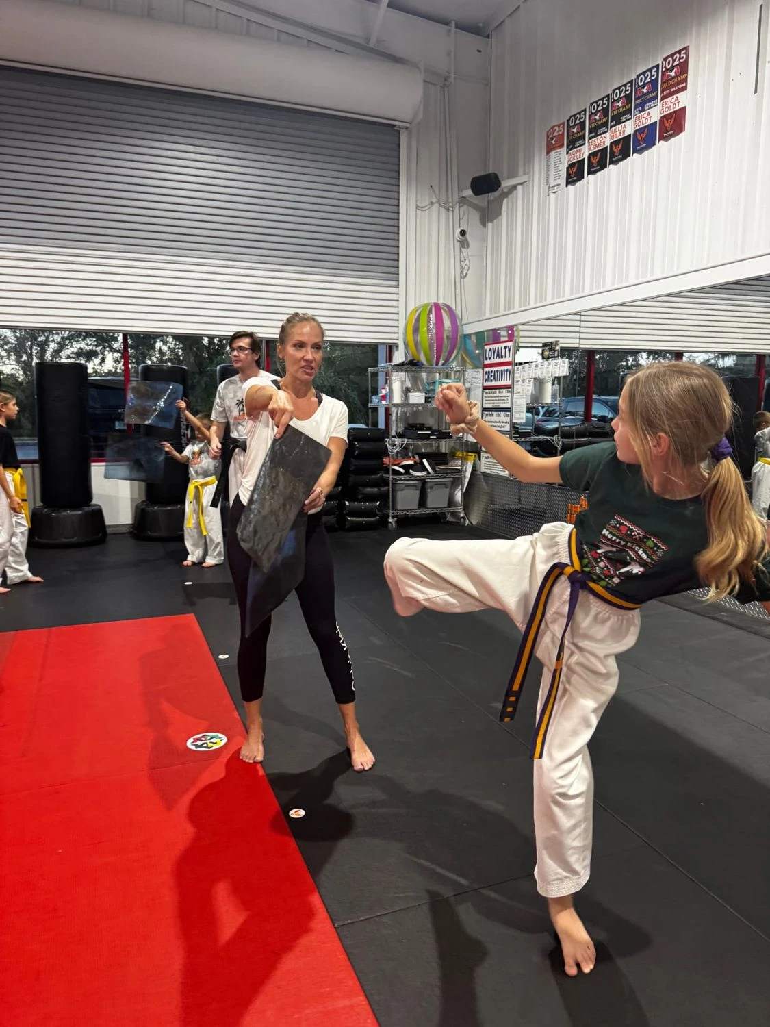 Karate Kids athlete performing side kick